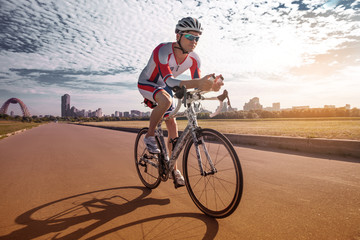Cyclist overtaking a breeze. Triathlon. Summer Olympics