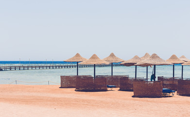 Beach umbrellas and blue sky background