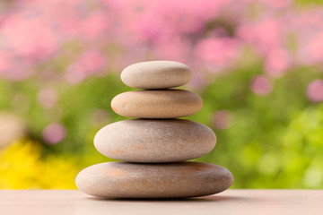 Obraz na płótnie Canvas balancing pebble zen stones outdoor