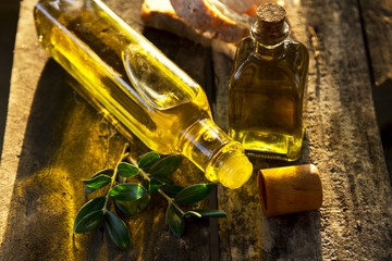 bottles of olive oil on old wood