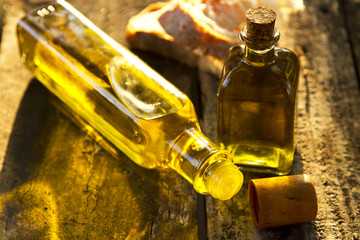 bottles of olive oil on old wood
