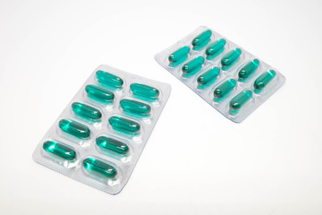 green soft gel capsules pills in blister pack