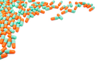 green orange color pills capsule on white background
