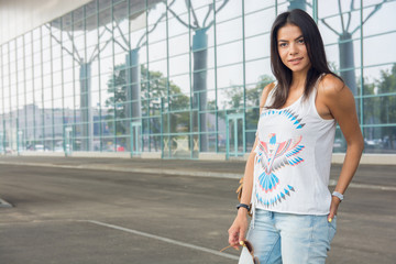 lifestyle portrait young woman walking on the street with backpa