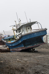 Fototapeta na wymiar old fishing boat on the shore