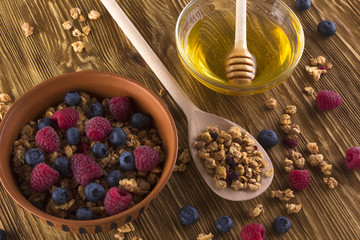 Muesli with fresh berries and honey.