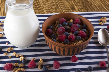 Muesli with fresh berries and milk.