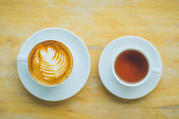 Coffee and tea cup on wooden table
