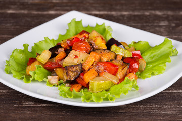 Vegetable stew in plate, close up.