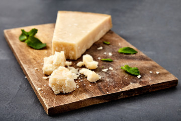 Piece of a parmesan and grated cheese
