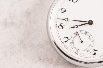 Naklejka premium Old pocket watch detail. Symbol of time, deadline and nostalgia.