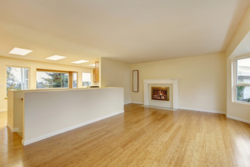 Empty living room interior with polished hardwood floor.