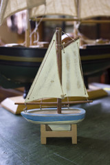 Vintage Retro Antique Toy Boats of Different Sizes on a Desk