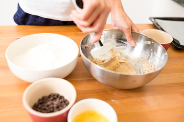 Mixing dough inside bowl