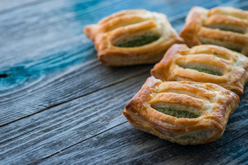 Freshly baked spinach pie on a rustic wooden table