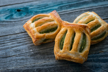 Freshly baked spinach pie on a rustic wooden table