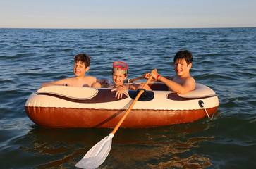 three brothers on the inflatable dinghy