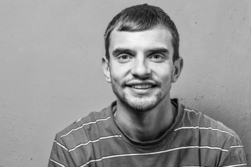 young man with beard with different emotions. black and white photo. emotional card. close up of a...