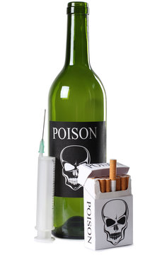 Cigarettes, wine and a syringe on a white background
