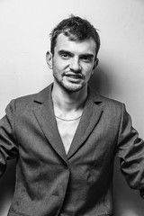 Obraz premium Close up of a funny young man in a jacket with different emotion. The collage of young man in a jacket with different emotion. emotional card. black and white photo. 