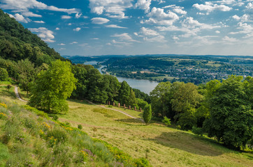 germany summer country landscape with meadow, forest and a sky, background