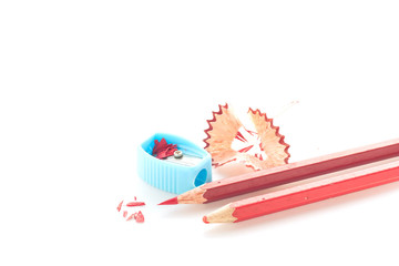 Pencil crayon and sharpener on white background.