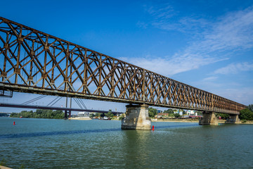 Fototapeta na wymiar old railroad bridge across the Sava River