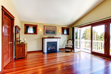 Room with beautiful chery hardwood floor and fireplace