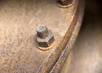 Rusty screw, machine part of an old factory 