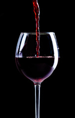 Naklejki  Nalewanie czerwonego wina do kieliszka
