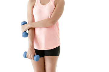 Young attractive girl exercising with pair of dumbbells