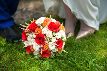 Beautiful bridal bouquet on the green grass