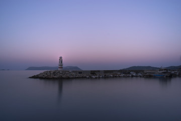 Lighthouse of Kas,, Resort in Turkey.
In the background the Greek Island of Kastelorizo