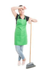 Young hypermarket employee with broom