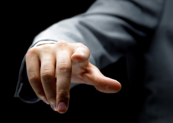 Obraz premium Businessman pressing an imaginary button
