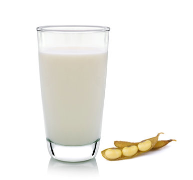 glass of milk and soy bean on white background