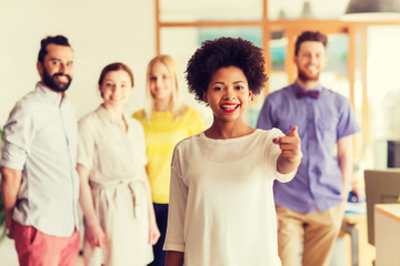 woman pointing to you over creative office team