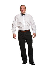 Elegant man standing over white background with bowtai.