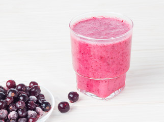 Delicious smoothie with black currant on the table