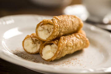 typical Sicilian pastries called CANNOLI with amarena listed in