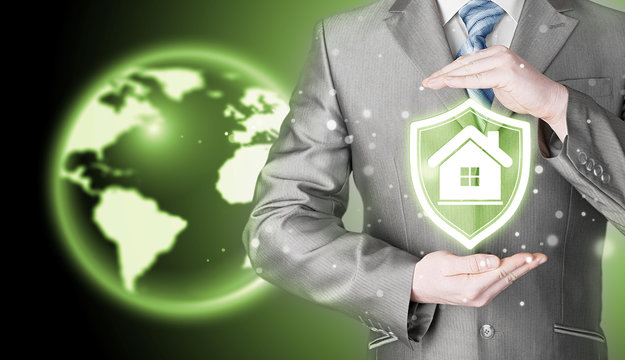 House protection and insurance. Home shield. Real estate safety. Globe background. World wide insurance.