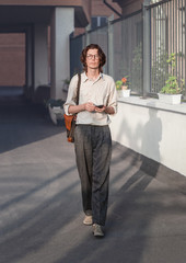 Man walking with smartphone in his hands