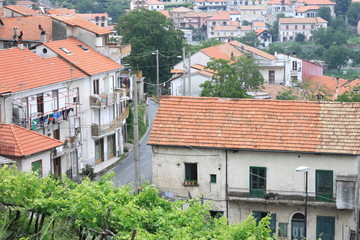 Beautiful city landscape in style of traditional Italian architecture. Amalfi Coast, Italy. Houses with roofs of red tile.