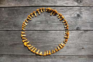 Fresh chanterelle mushrooms on a rustic table 