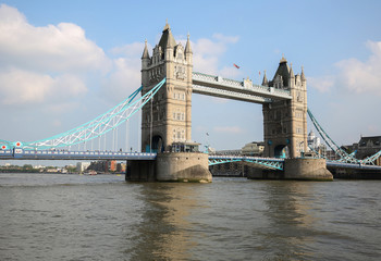 Fototapeta na wymiar Beautiful Tower Bridge in London with the Union Jack flag blowing on the bridge