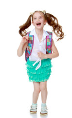 Schoolgirl jumping with a briefcase