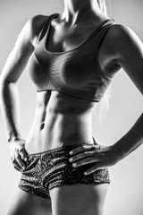 Perfect fitness body on black and white photo