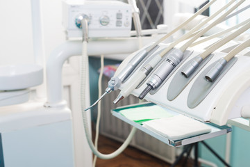 Stomatological instrument in the dentists clinic. Operation, tooth replacement.