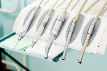 Stomatological instrument in the dentists clinic. Operation, tooth replacement.