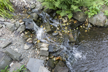 Small waterfall between the rocks.
